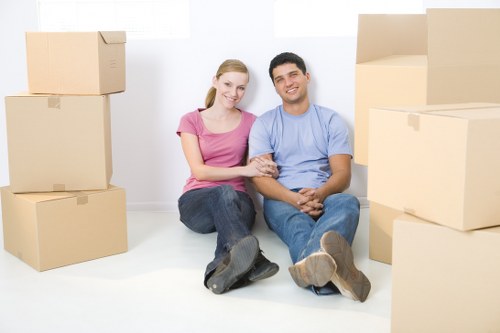 Professional movers handling furniture during a Northwoolwich house move